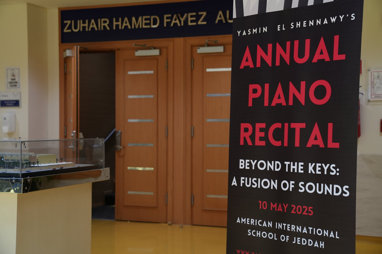 Banner for the 4th Annual Piano Recital outside the Zuhair Hamed Fayez Auditorium